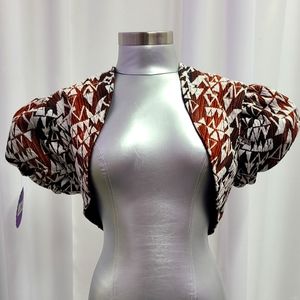 Designer Maggie Barry  Chic  Geometric print costom made puff sleeve shrug.